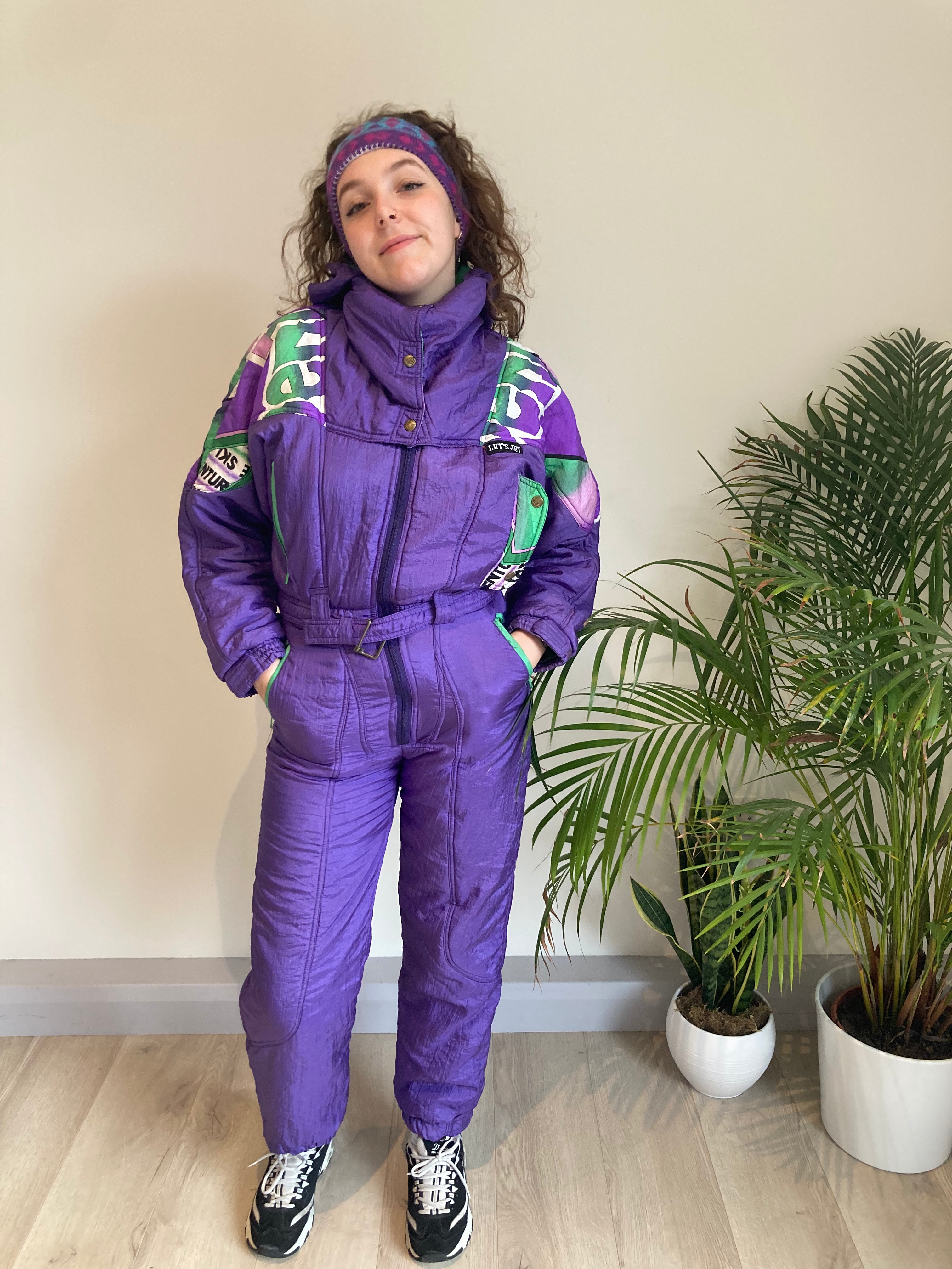 purple and green design ski suit