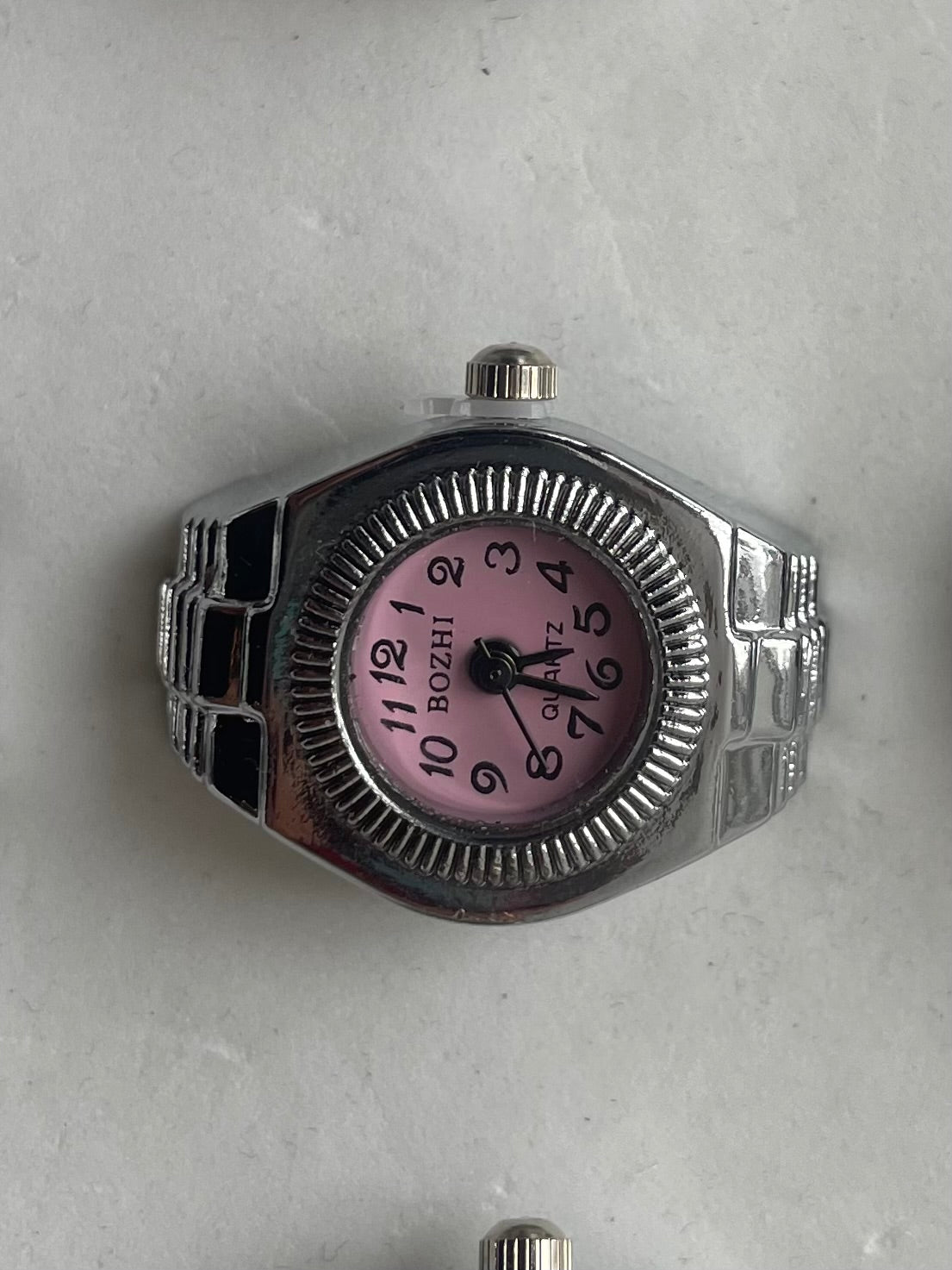Pink face circular watch ring 