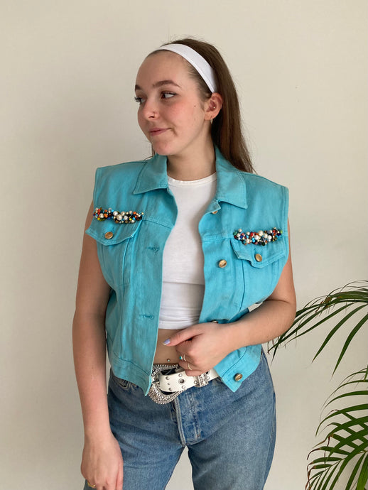 sky blue sleeveless beaded pocket denim jacket